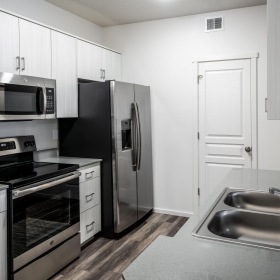 a kitchen with white cabinets