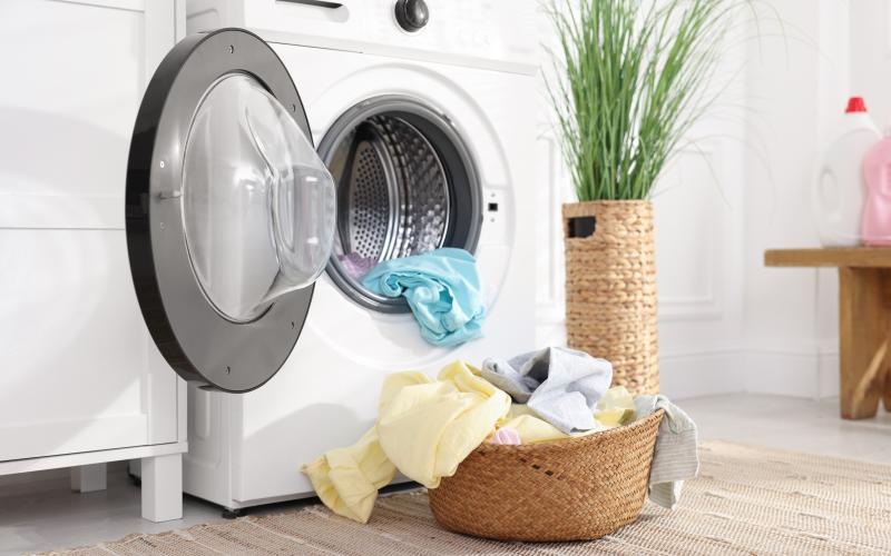 a laundry basket with clothes in it