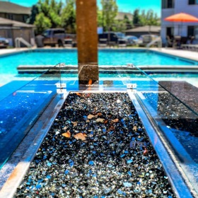 a pool with a fire pit